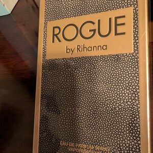 Rihanna Black and Gold Perfume Box with Textured Pattern and Bold Typography
